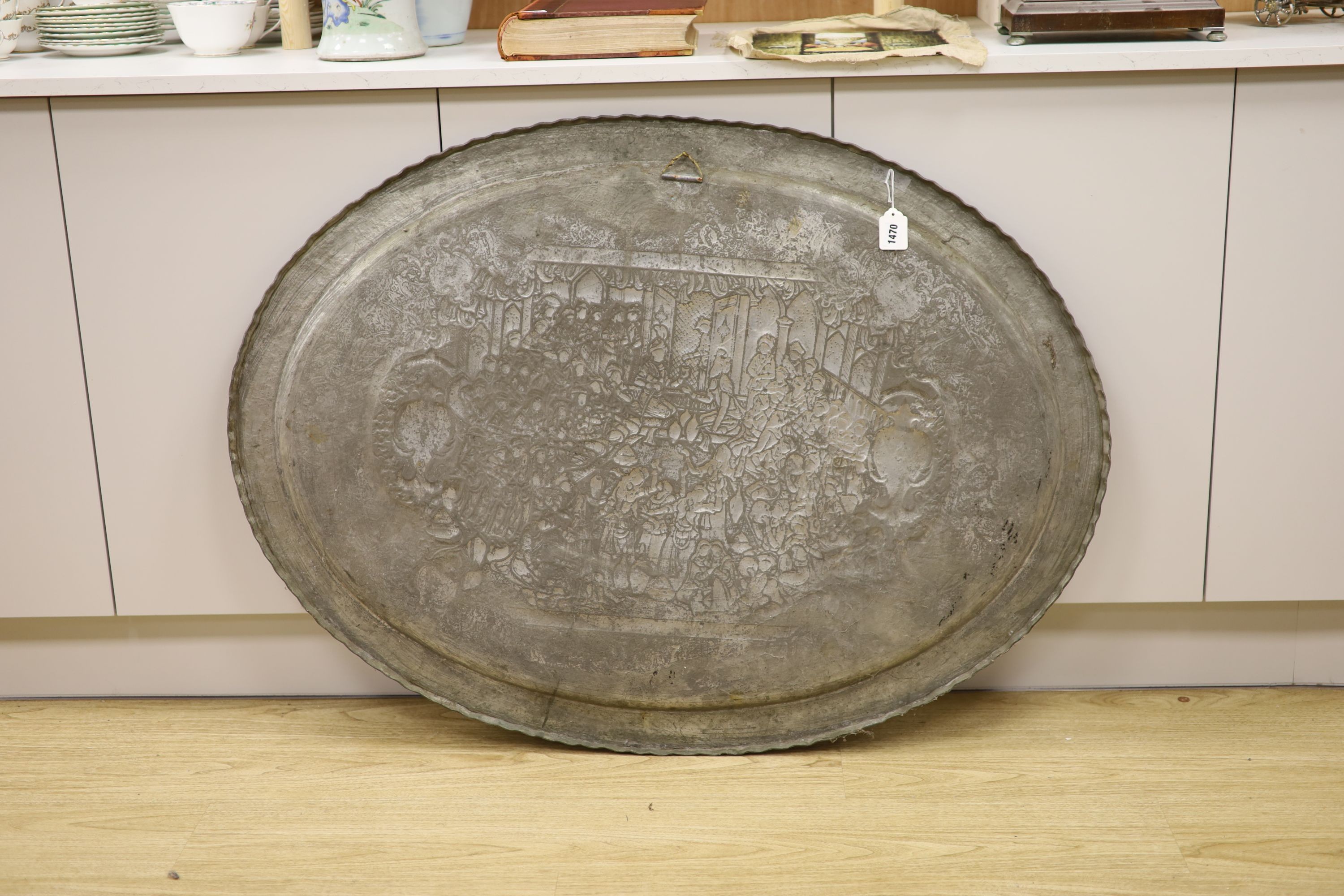 A large early 20th century Persian tinned and gilded repouse work wall plaque, 114cm across